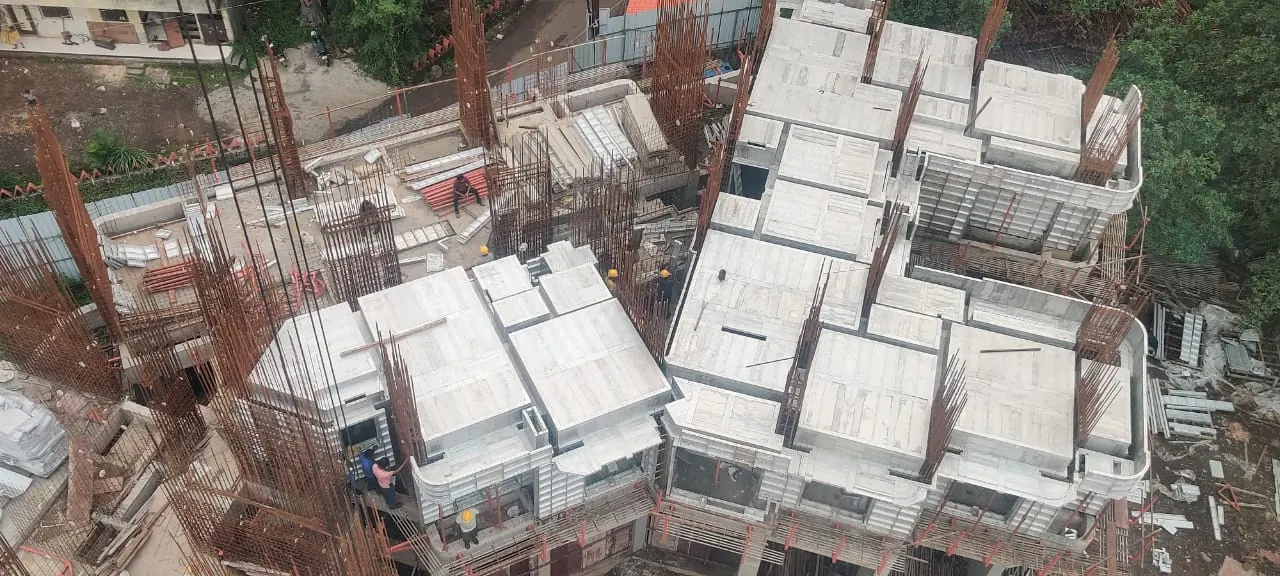 Slab panels in place across completed units